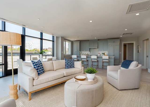 387 Commercial St Unit 709, Portland, ME 04101 - living room featuring expansive windows and recessed lighting
