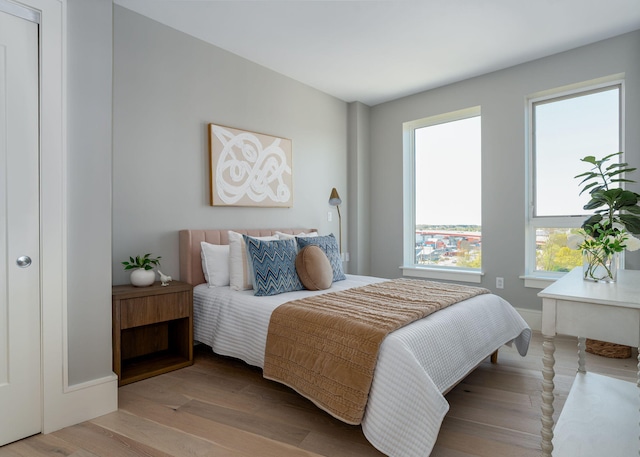 387 Commercial St Unit 709, Portland, ME 04101 - bedroom featuring wood finished floors
