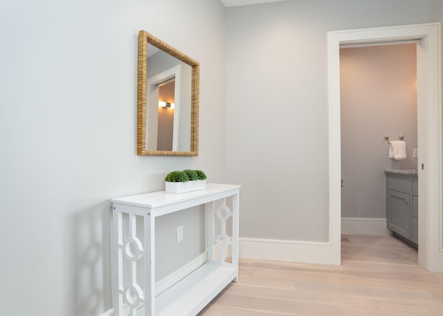 387 Commercial St Unit 709, Portland, ME 04101 - hallway featuring light wood-type flooring and baseboards