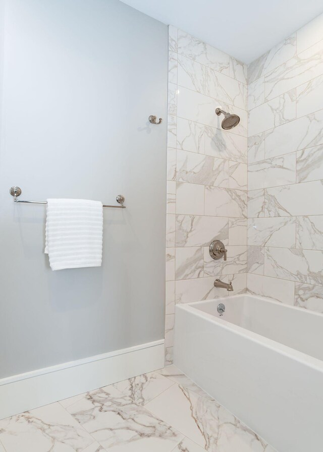 387 Commercial St Unit 709, Portland, ME 04101 - full bath with marble look tiles, bathing tub / shower combination, and baseboards