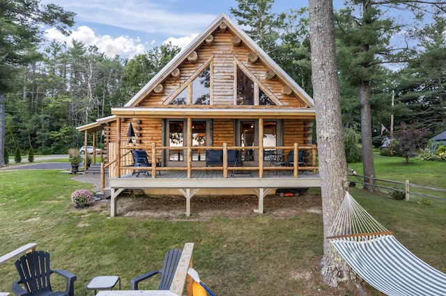 114 Fort Rd, Edgecomb, ME 04556 - rear view of house featuring a lawn, log exterior, and fence
