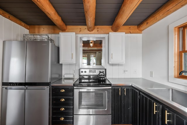 114 Fort Rd, Edgecomb, ME 04556 - kitchen with white cabinetry, beam ceiling, appliances with stainless steel finishes, and a sink
