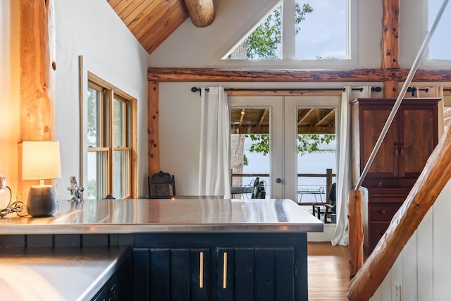 114 Fort Rd, Edgecomb, ME 04556 - office with french doors, beamed ceiling, plenty of natural light, and light wood-style floors
