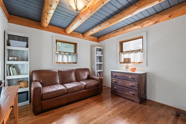 living room with wooden ceiling, hardwood / wood-style flooring, and a healthy amount of sunlight