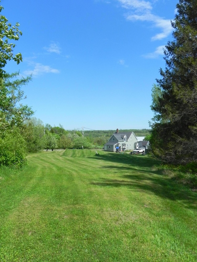 view of property's community with a lawn