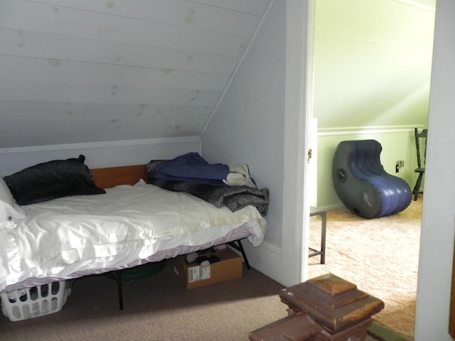 carpeted bedroom featuring vaulted ceiling