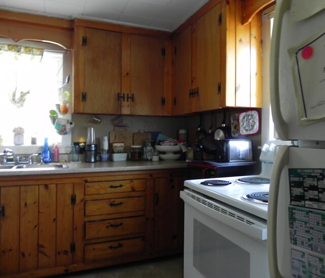 kitchen with sink and white appliances