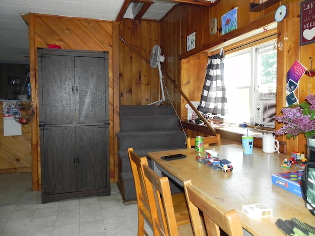 dining area with wooden walls