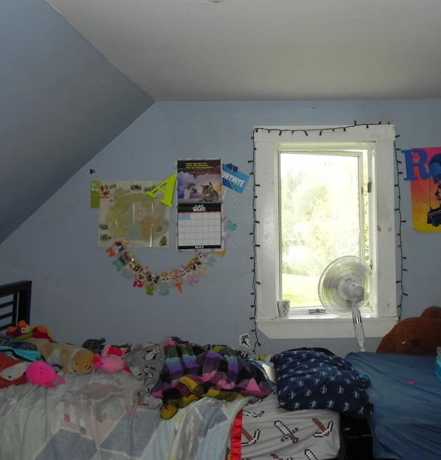 bedroom with lofted ceiling