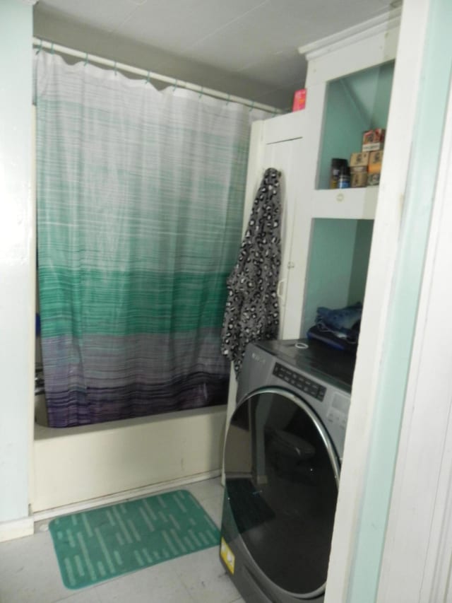 clothes washing area featuring washer / clothes dryer