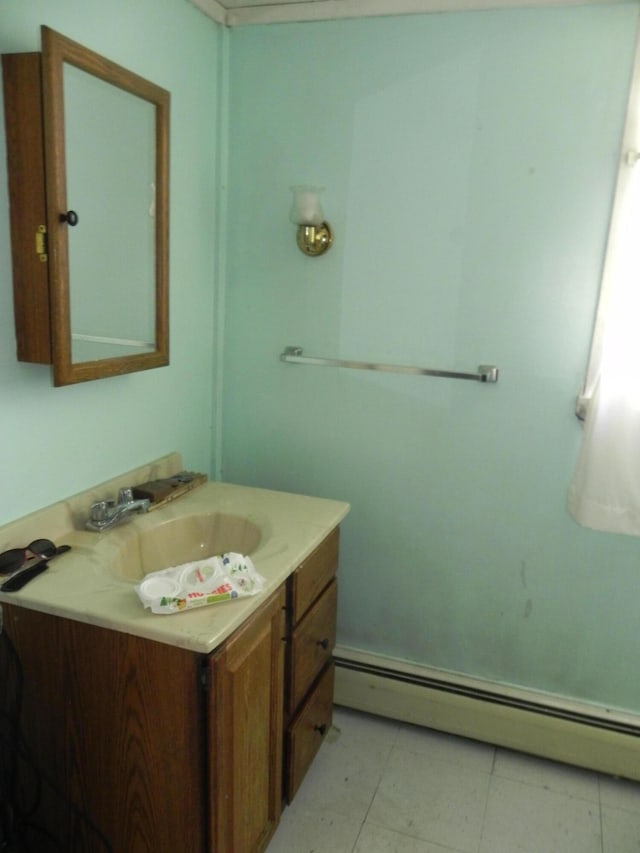 bathroom with vanity and a baseboard radiator