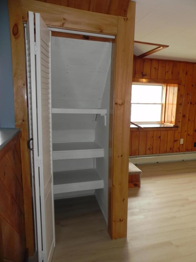 closet with a baseboard heating unit