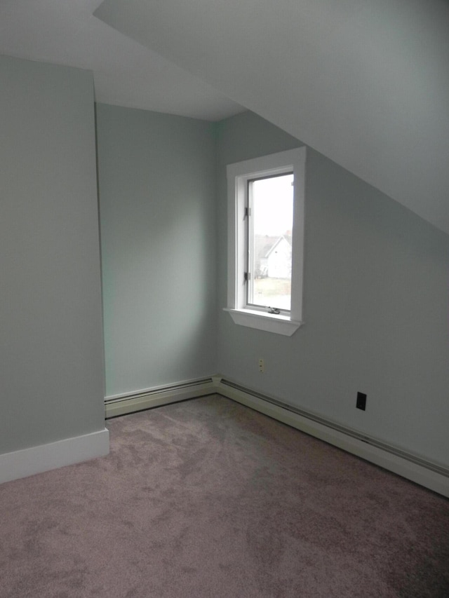 additional living space with carpet and baseboards