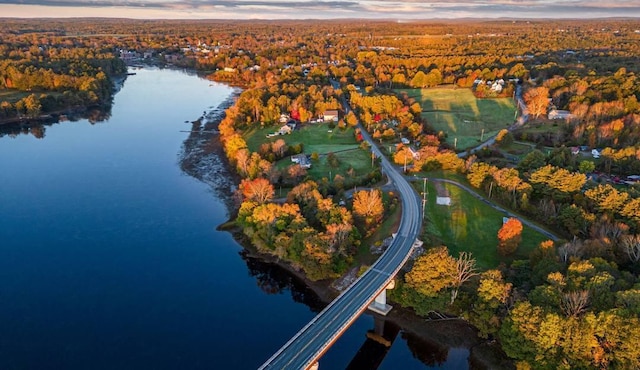 aerial view at dusk with a water view