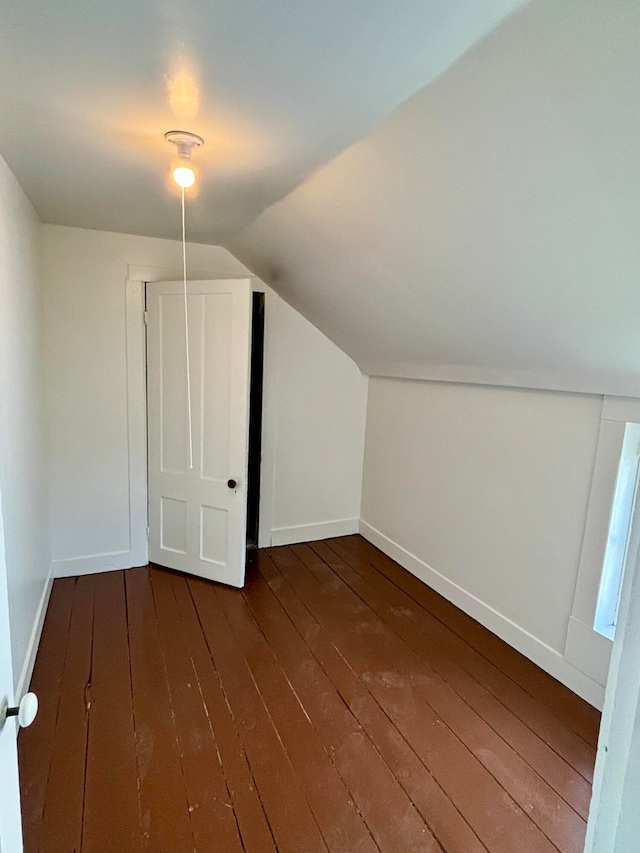 bonus room featuring lofted ceiling and hardwood / wood-style flooring