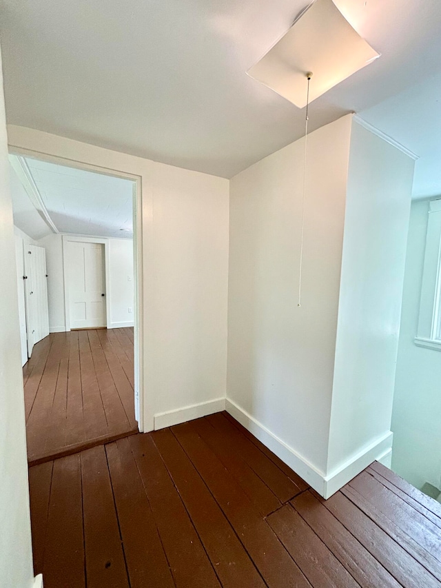 unfurnished room with hardwood / wood-style flooring