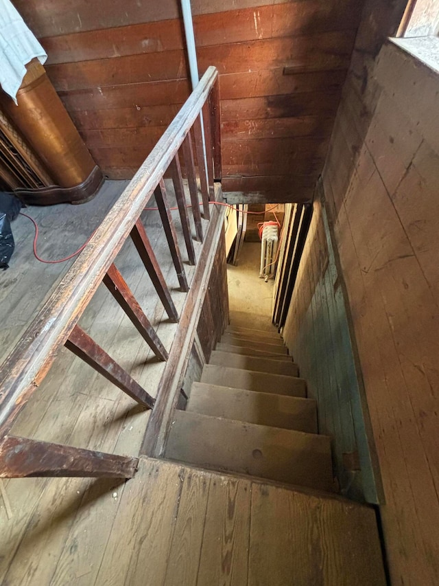 stairs featuring wood-type flooring