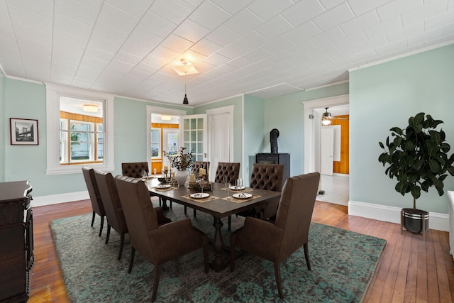 dining room featuring ceiling fan, ornamental molding, and hardwood / wood-style floors