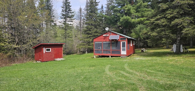 457 Porter Nadeau Rd, Eustis, ME 04936 - view of grassy yard featuring a storage shed and a forest view