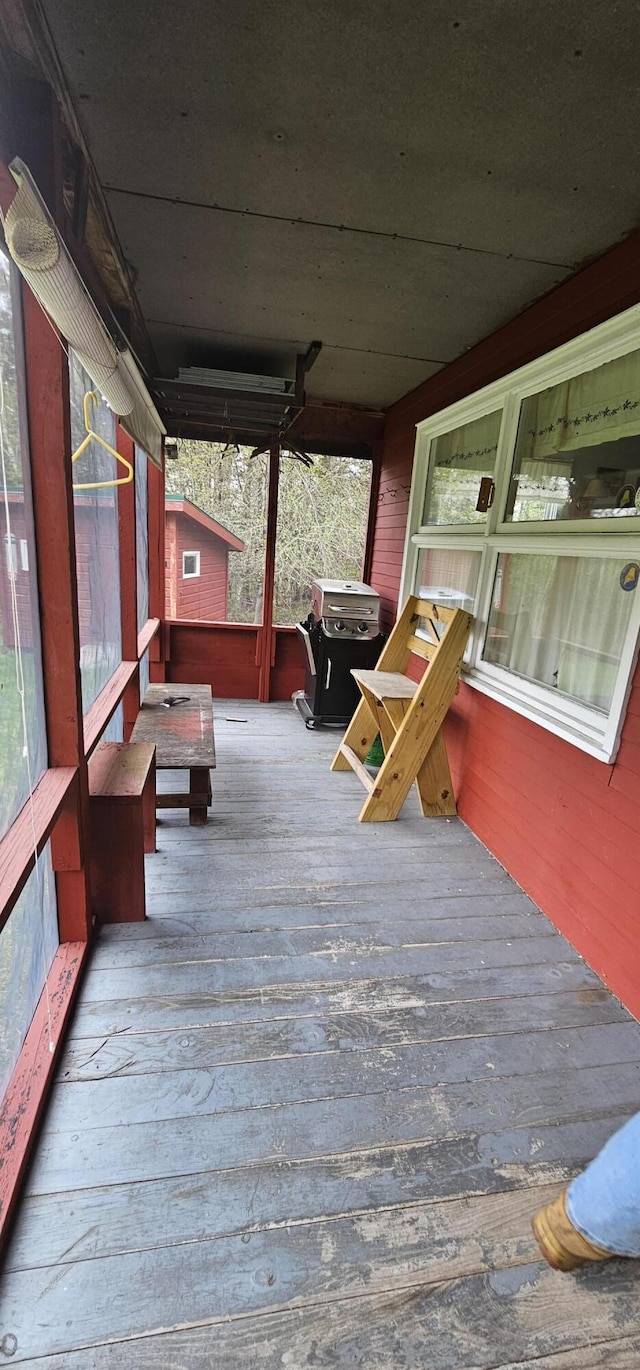 wooden terrace featuring a porch