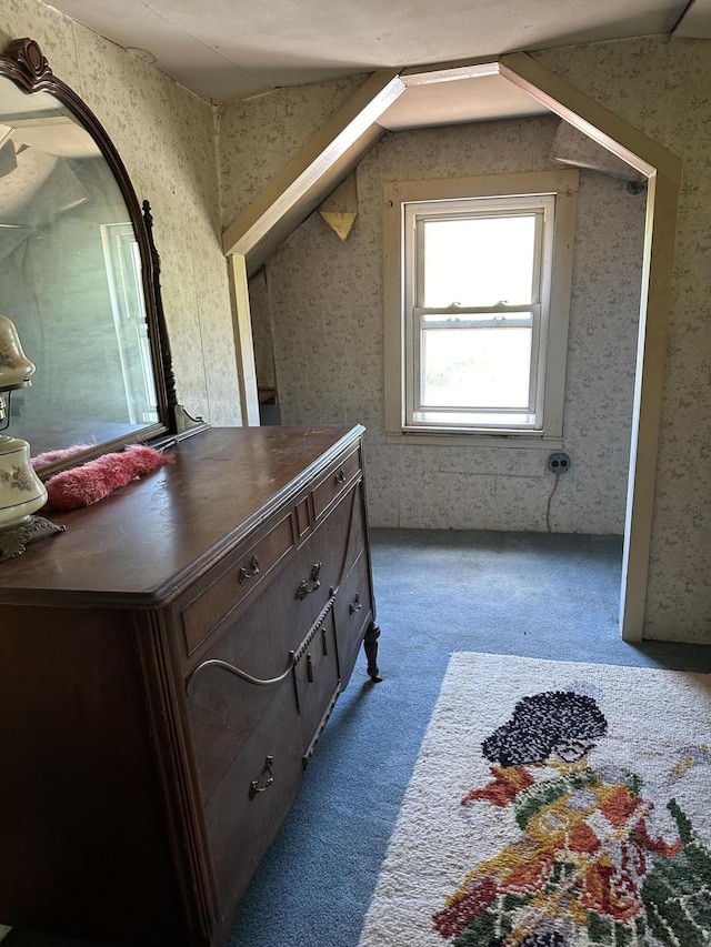 bathroom featuring lofted ceiling