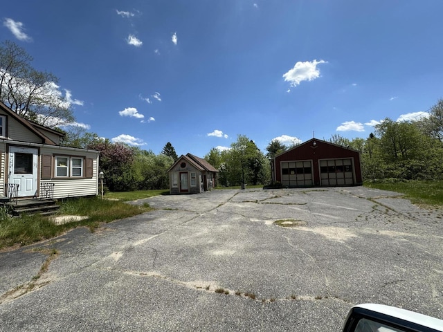 view of car parking featuring a garage