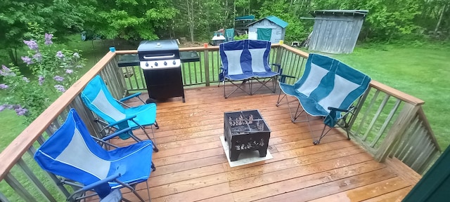 deck with grilling area and a yard