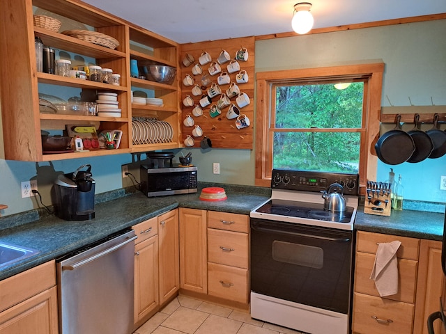 kitchen featuring appliances with stainless steel finishes and light tile patterned flooring