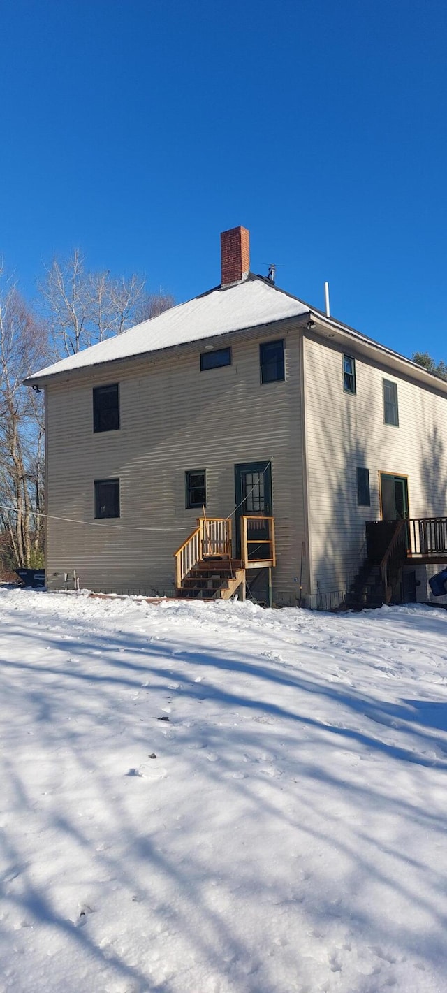 view of snow covered house