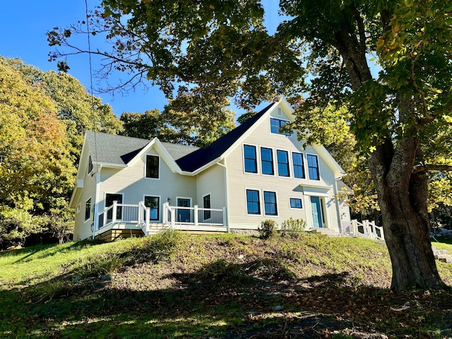 back of property with a deck
