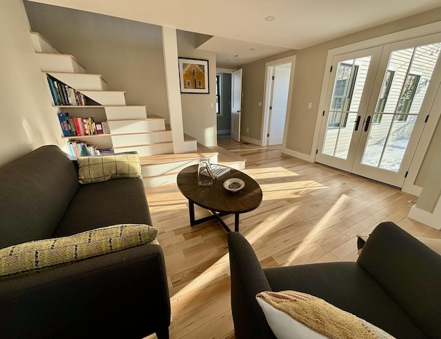 living room featuring light hardwood / wood-style floors and french doors