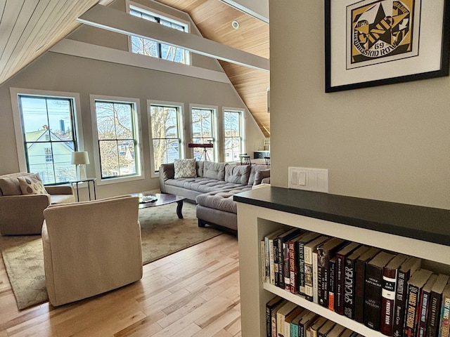 living room with vaulted ceiling, wood ceiling, and light hardwood / wood-style floors