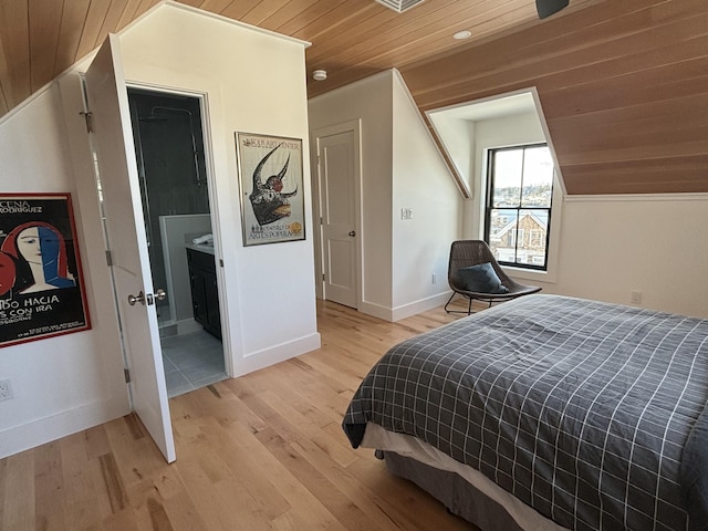 bedroom featuring lofted ceiling, wooden ceiling, and light hardwood / wood-style flooring