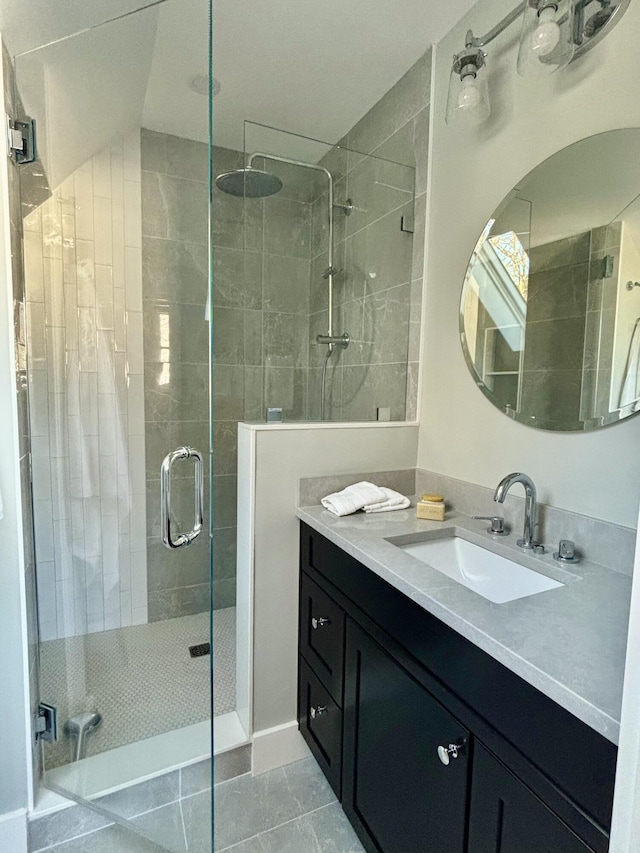 bathroom with vanity, tile patterned floors, and a shower with shower door