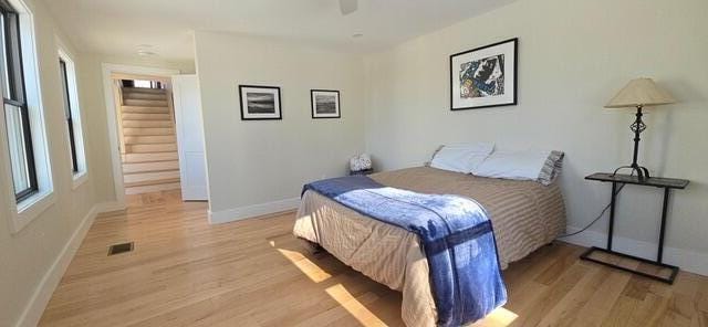 bedroom featuring ceiling fan and light hardwood / wood-style floors