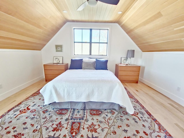 bedroom with vaulted ceiling, wood finished floors, a ceiling fan, wooden ceiling, and baseboards