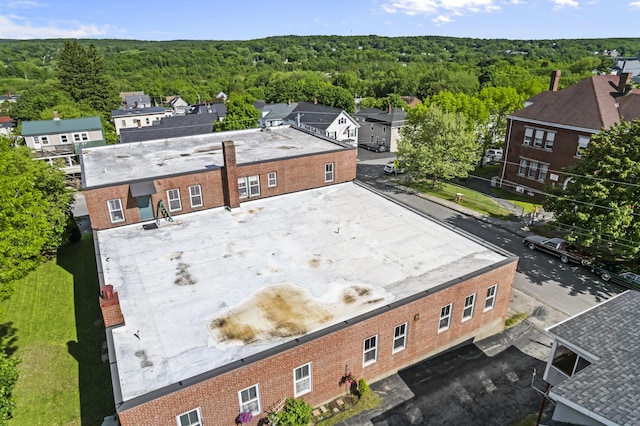 aerial view featuring a wooded view
