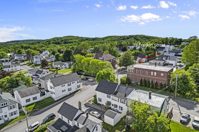 bird's eye view featuring a residential view and a view of trees