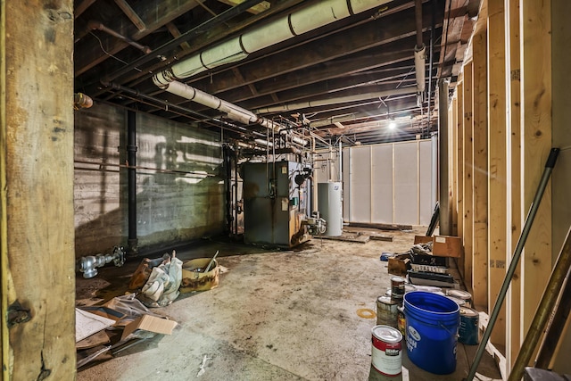 unfinished basement featuring heating unit and gas water heater