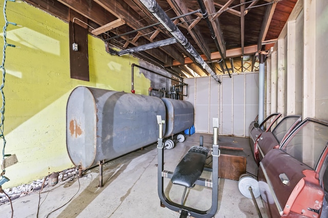 unfinished basement featuring heating fuel