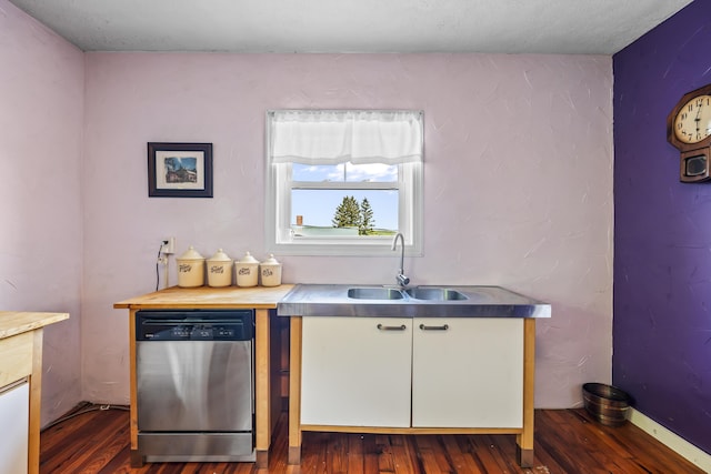 kitchen featuring dishwasher, white cabinets, a sink, and dark wood-style floors