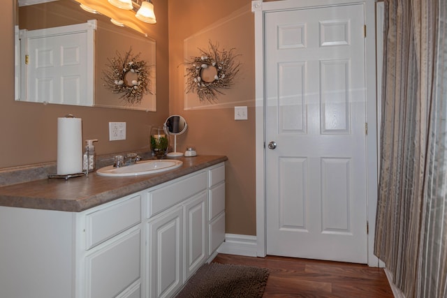 bathroom with wood-type flooring and vanity