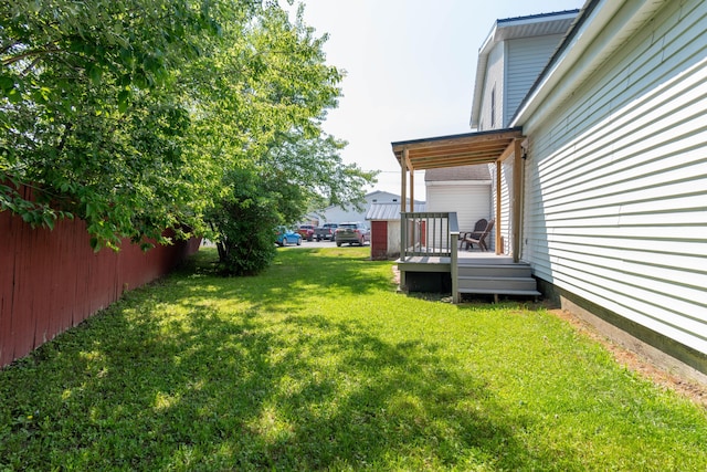 view of yard with a wooden deck