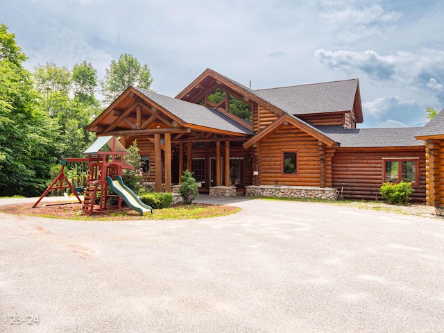 cabin featuring a playground