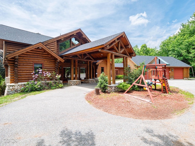 log home with a playground