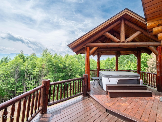 wooden terrace with a hot tub