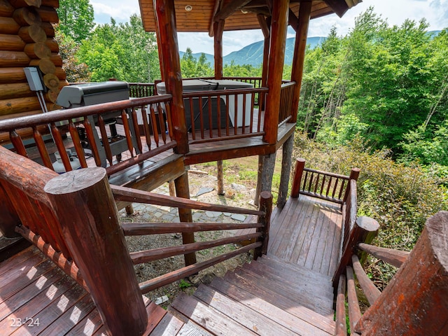 wooden deck with a mountain view