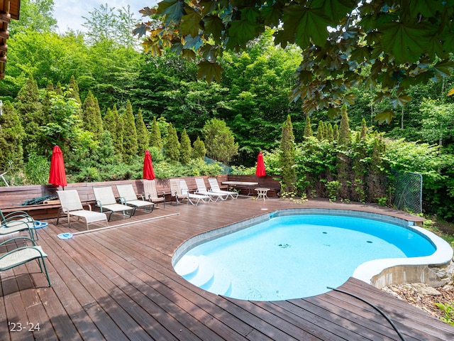 view of pool with a wooden deck