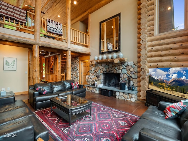 living room featuring a fireplace, wooden ceiling, rustic walls, and a high ceiling