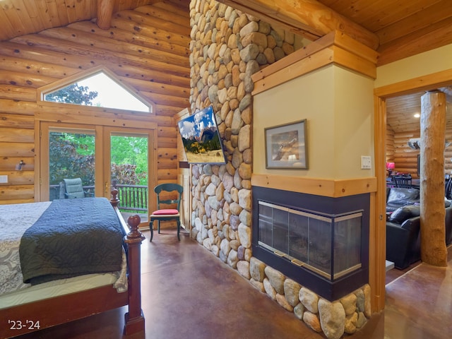 bedroom featuring a stone fireplace, log walls, and high vaulted ceiling